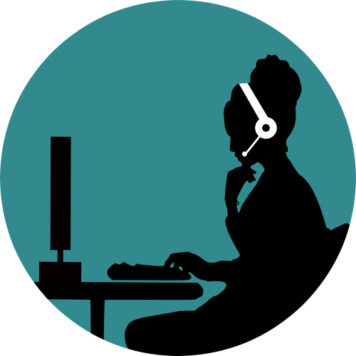 woman at desk with headset